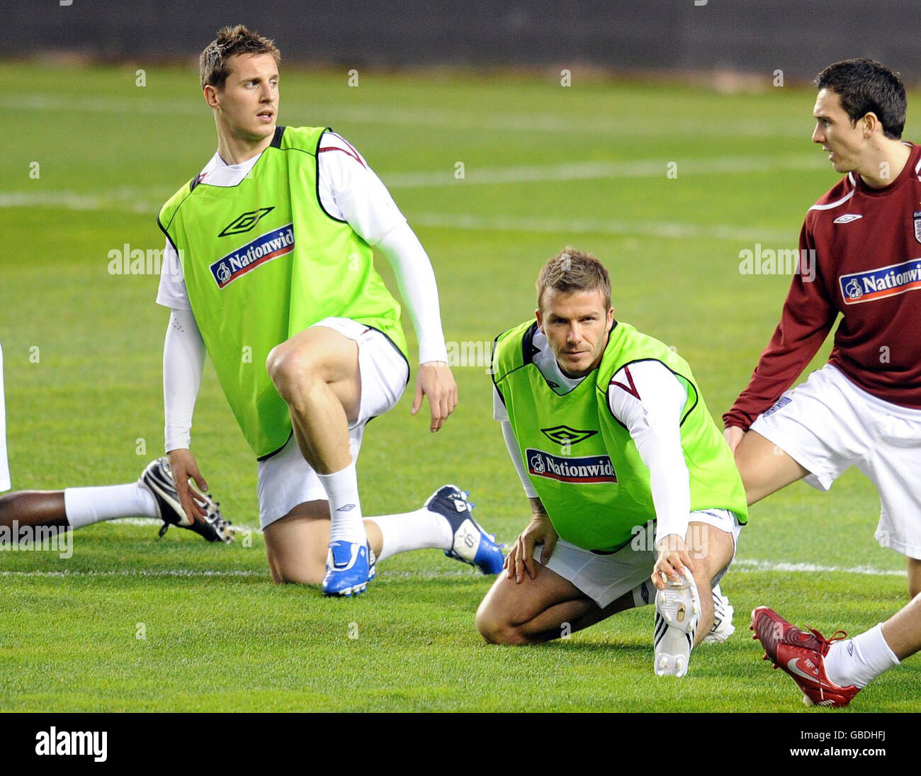 England's Phil Jagielka (left), David Beckham (centre) and Stewart Downing during a training session at the Ramon Sanchez Pizjuan Stadium in Seville, Spain. Stock Photo