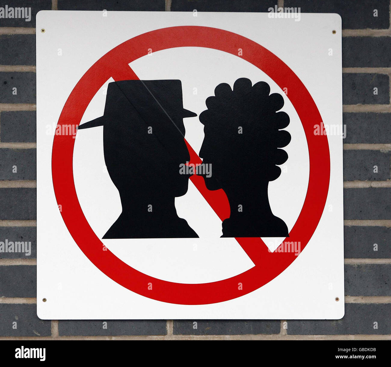A No Kissing sign which has been unveiled at Warrington Bank Quay station in Warrington, Cheshire, in a bid to cut delays. Stock Photo