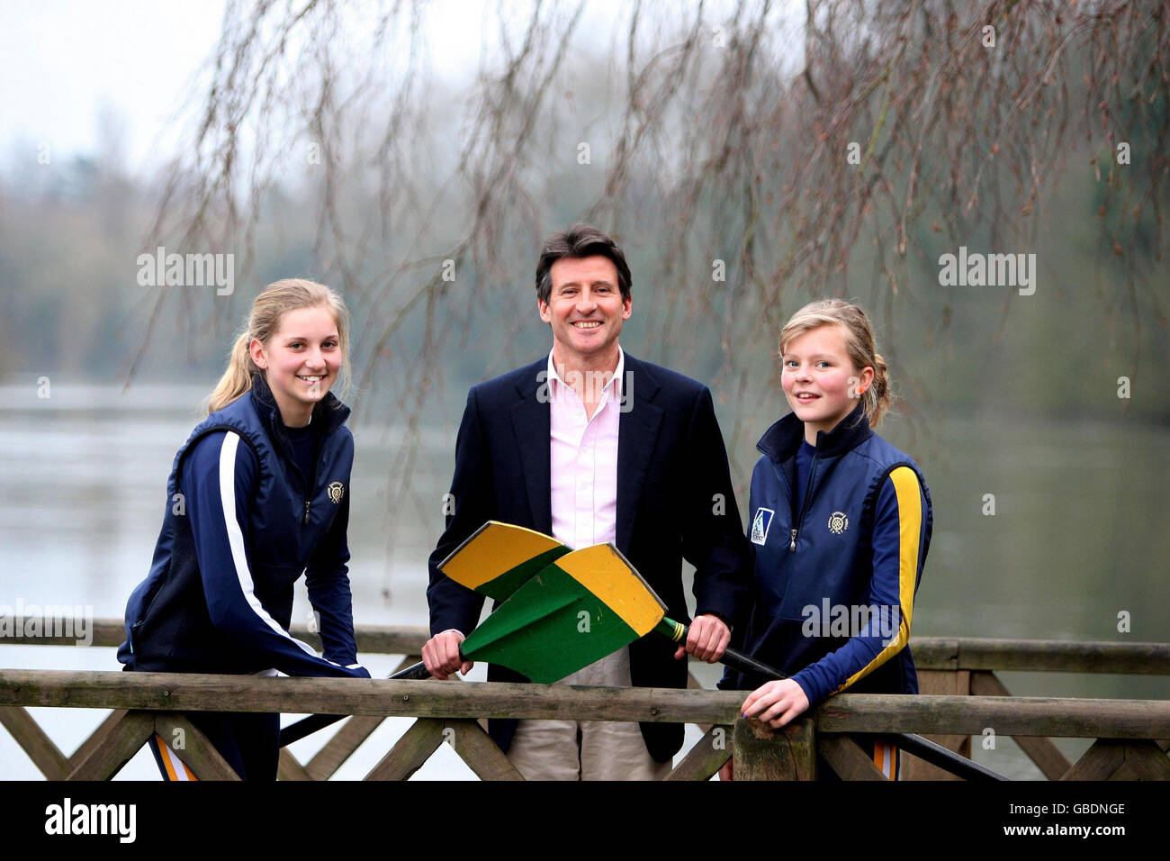 Chair of the London Organising Committee of the Olympic Games, Lord Sebastian Coe, talks to local junior rowers 12-year-old Sasha Quarrington (r) and 13-year-old Alessandra French at the Oakley Court Hotel, near Windsor, Berkshire. Stock Photo