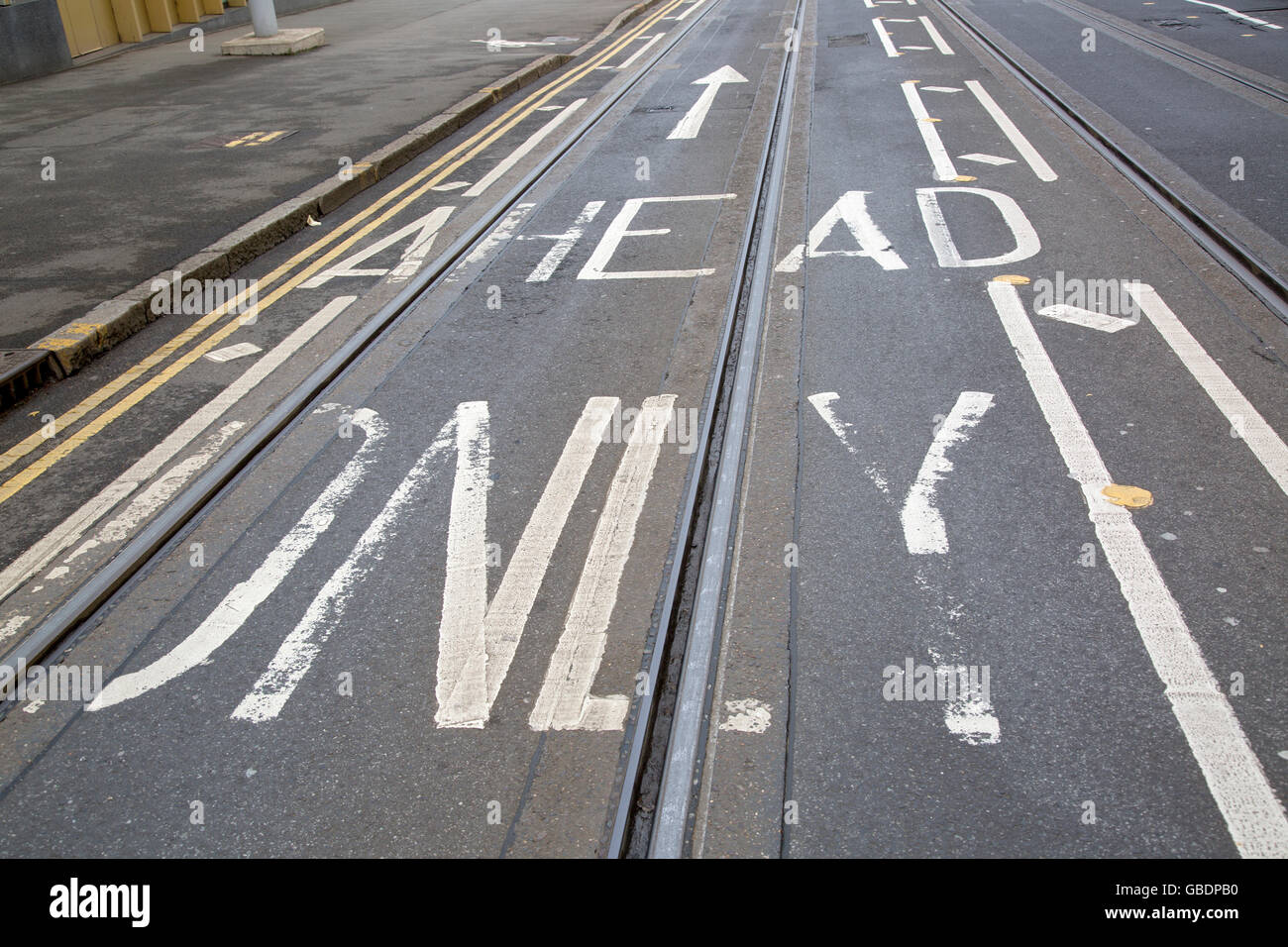 Tram Tracks and Arrow Sign on Street in Nottingham, England, UK Stock Photo