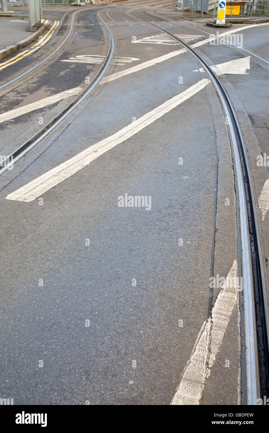 Tram Tracks and Arrow Sign on Street in Nottingham, England, UK Stock Photo