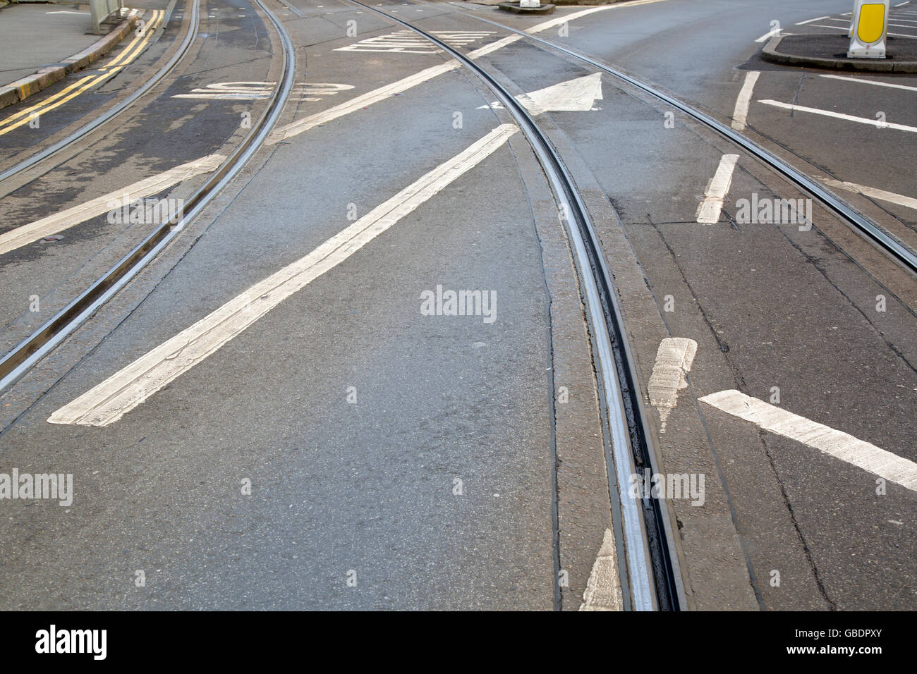 Tram Tracks and Arrow Sign on Street in Nottingham, England, UK Stock Photo