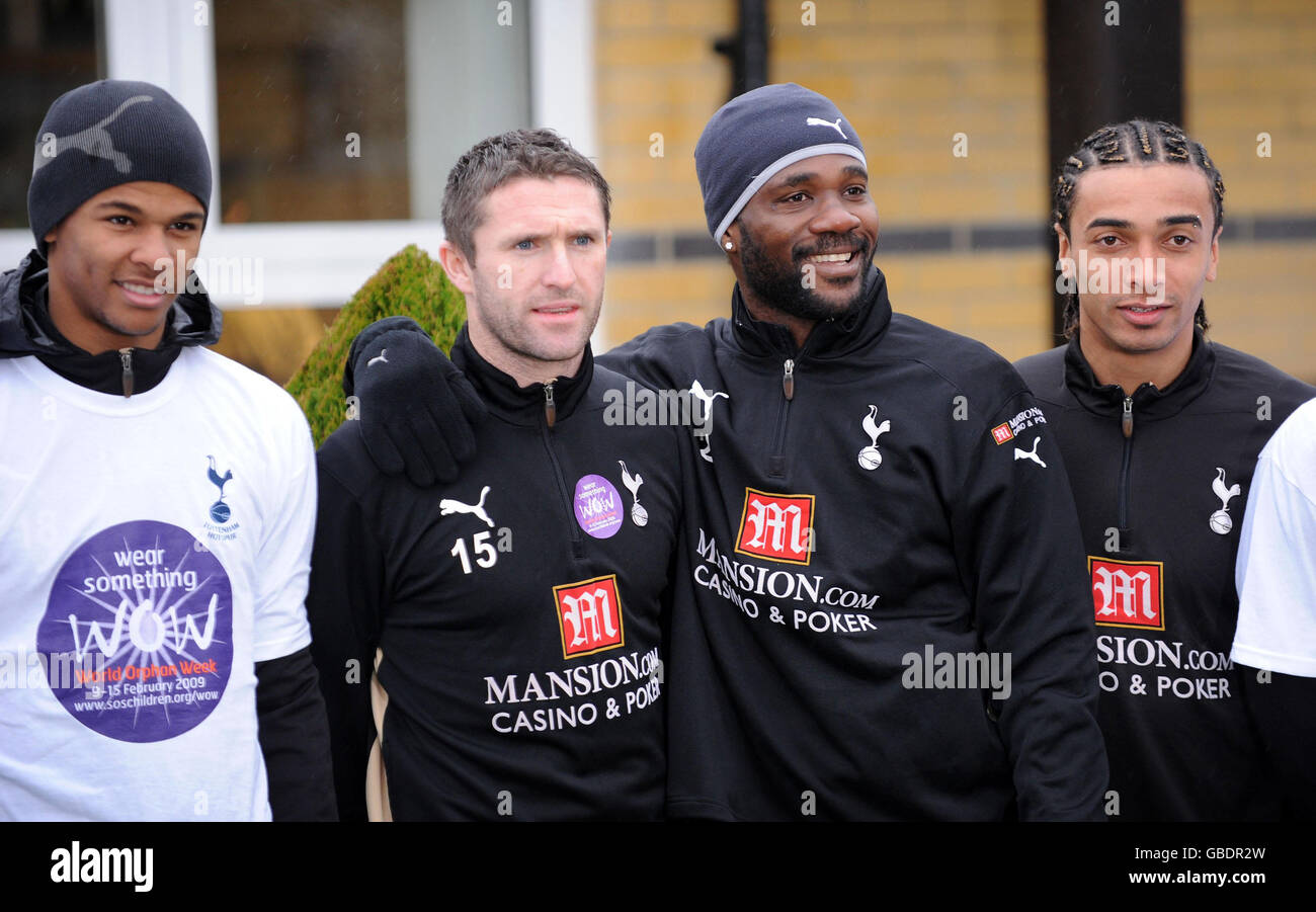 New Tottenham FC signing and captain Robbie Keane (second left) with