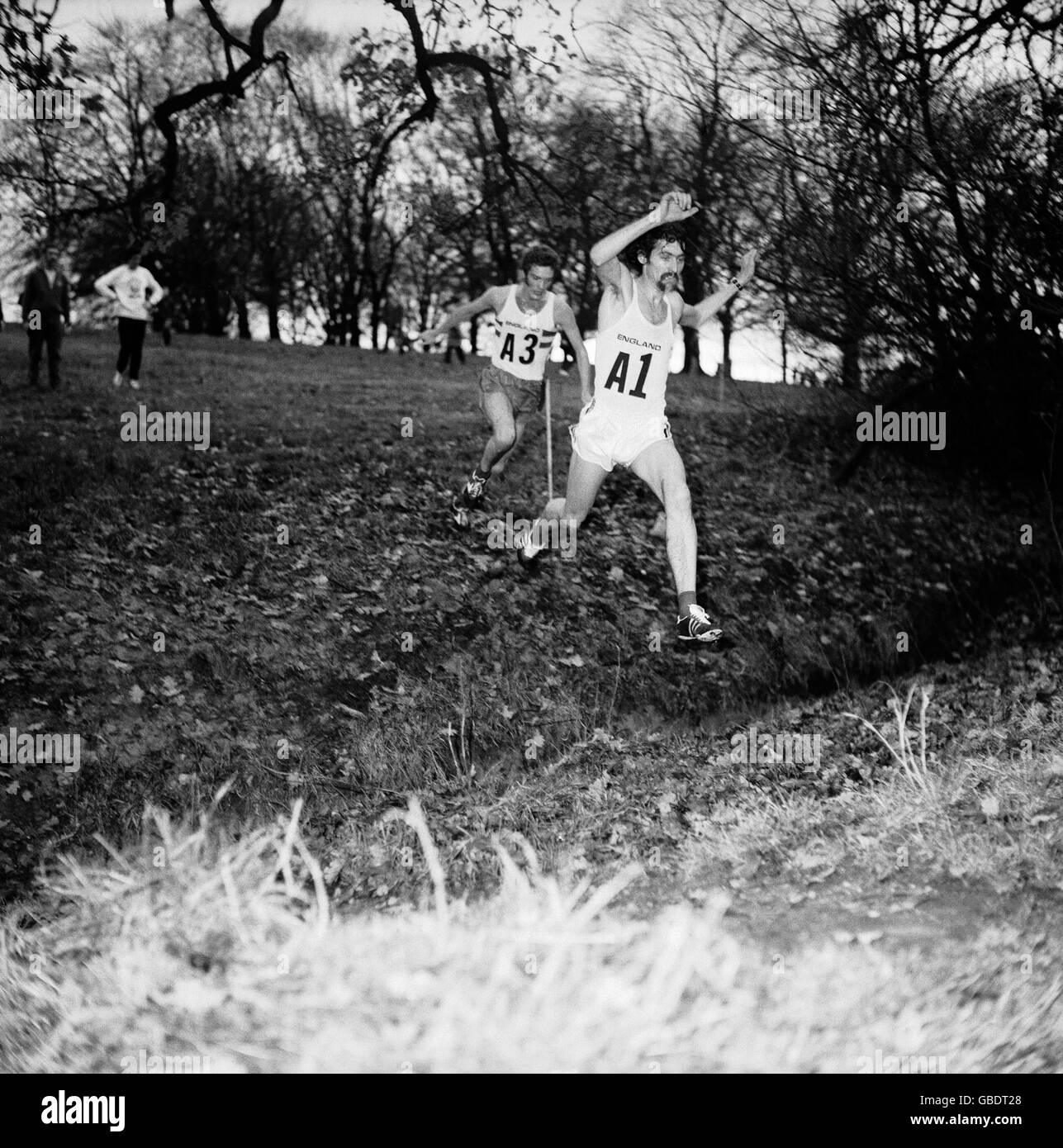 Dave bedford leaps a dyke on his way to victory hires stock