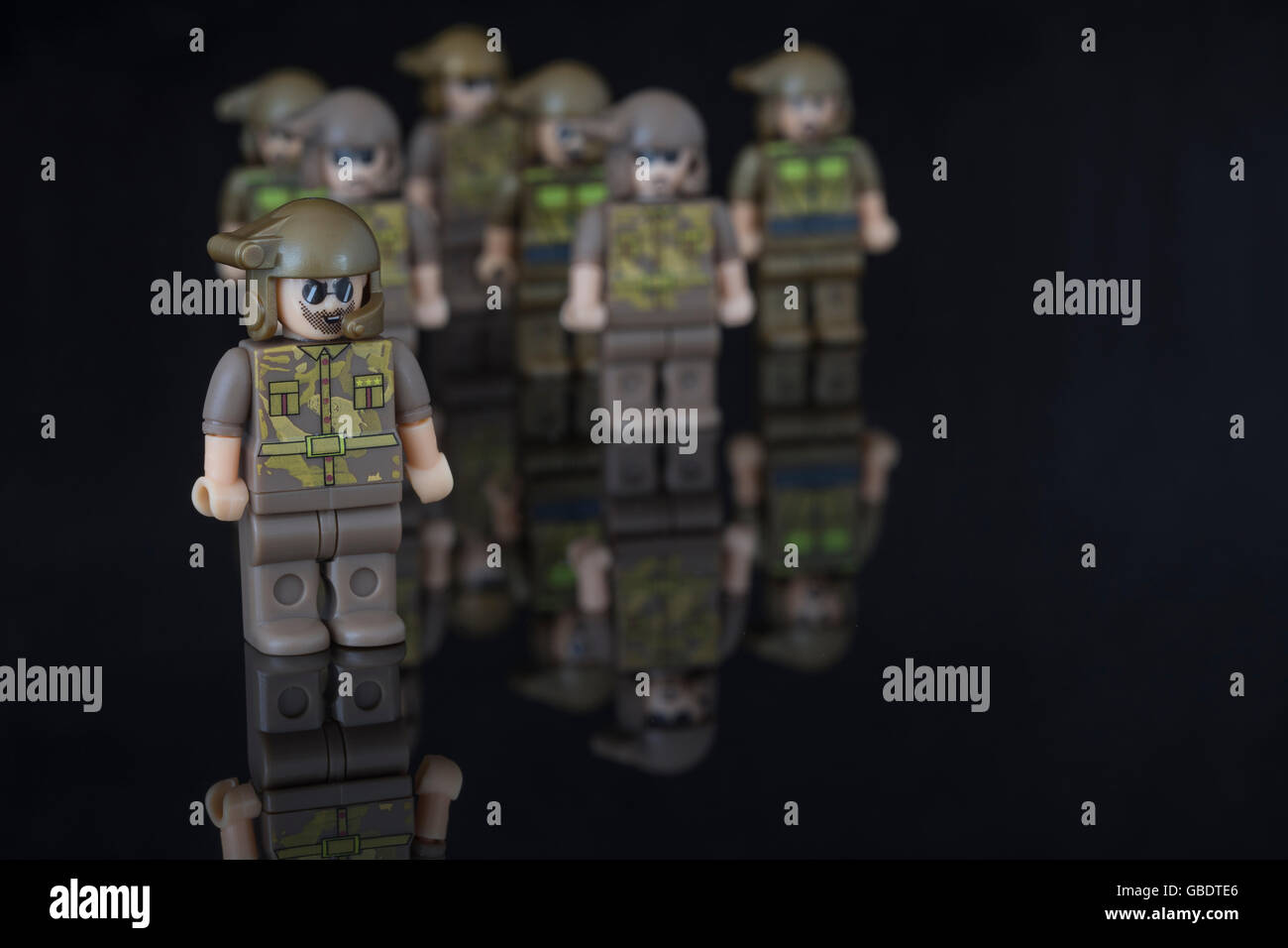 European Army concept, Special Forces / SAS, represented by small toy soldiers. Allegory / metaphor for teamwork and leadership. Stock Photo