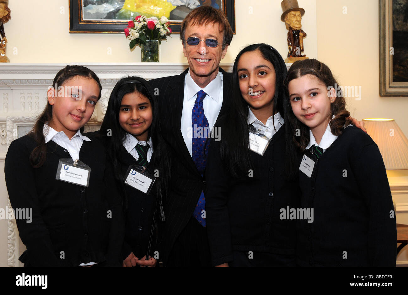 Bee Gee Robin Gibb, 59, attending a reception for Diana Award winners at 11 Downing Street with Yeading Junior School students, recognised for their work in peer mediation (left to right) Baljoyt Mangat, Simran Johal, Lorita Krsniqi and Yasmin Dummett. Stock Photo