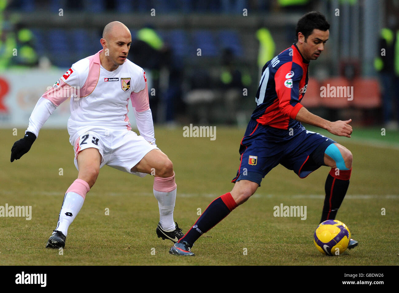 Soccer - Italian Serie A - Genoa v Palermo - Comunale Luigi Ferraris. Genoa's Giandomenico Mesto (right) in action with Palermo's Mark Bresciano. Stock Photo