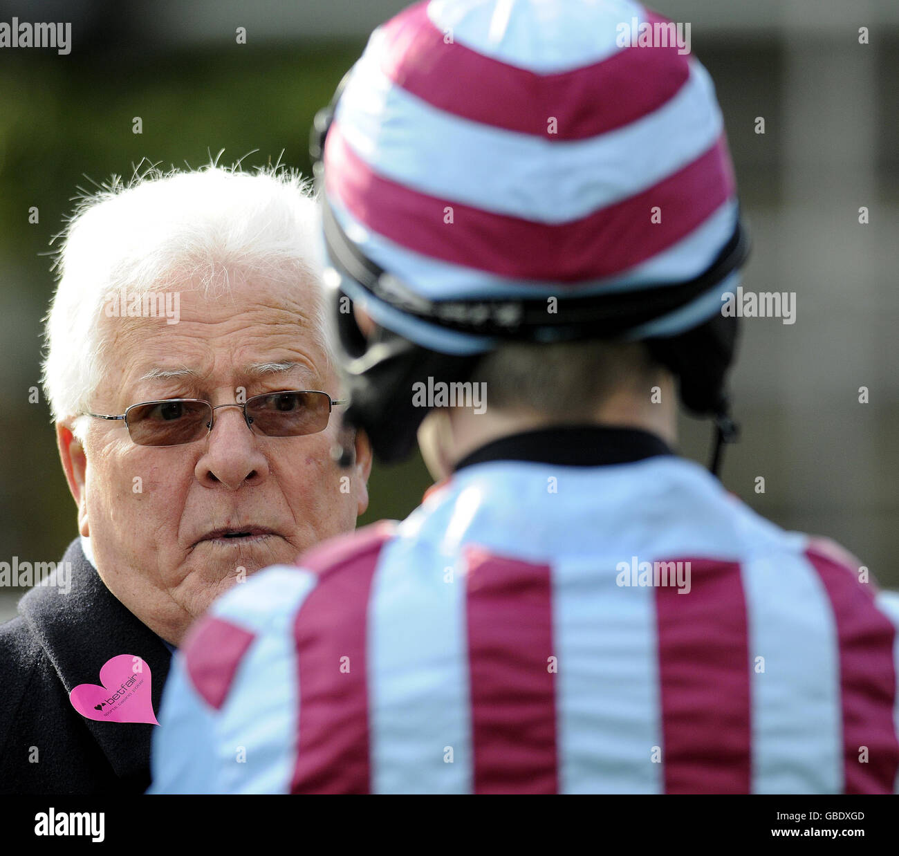Owner of Breedsbreeze Jim Lewis talks to jockey Ruby Walsh during the Betfair Ascot Chase Day at Ascot Racecourse, Berkshire. Stock Photo