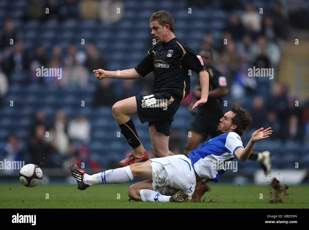 Blackburn Rovers' Gael Givet (right) slides in to challenge Coventry City's Jordan Henderson for the ball. Stock Photo