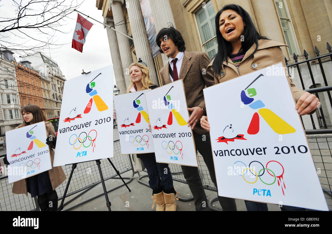 Supporters of PETA (People for the Ethical Treatment of Animals) launch a new poster campaign, parodying the 2010 Olympic Winter Games logo, outside the Canadian Embassy in London, in reaction to Canada's forthcoming annual seal cull. Stock Photo