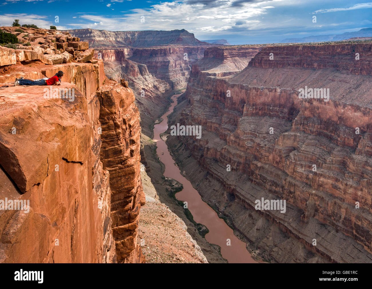 Two young men looking at Grand Canyon from Toroweap Point at North Rim, 1000 meters above Colorado River, Arizona, USA Stock Photo
