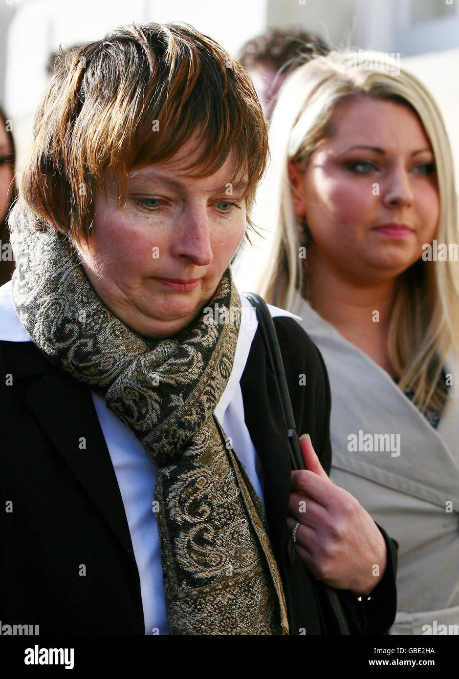 Deborah Yates, left, arrives with family members at Lewes Crown Court, in East Sussex, for the sentencing of Samuel Reid-Wentworth, the man convicted of the attempted murder of her daughter, Lucy, last year. Stock Photo