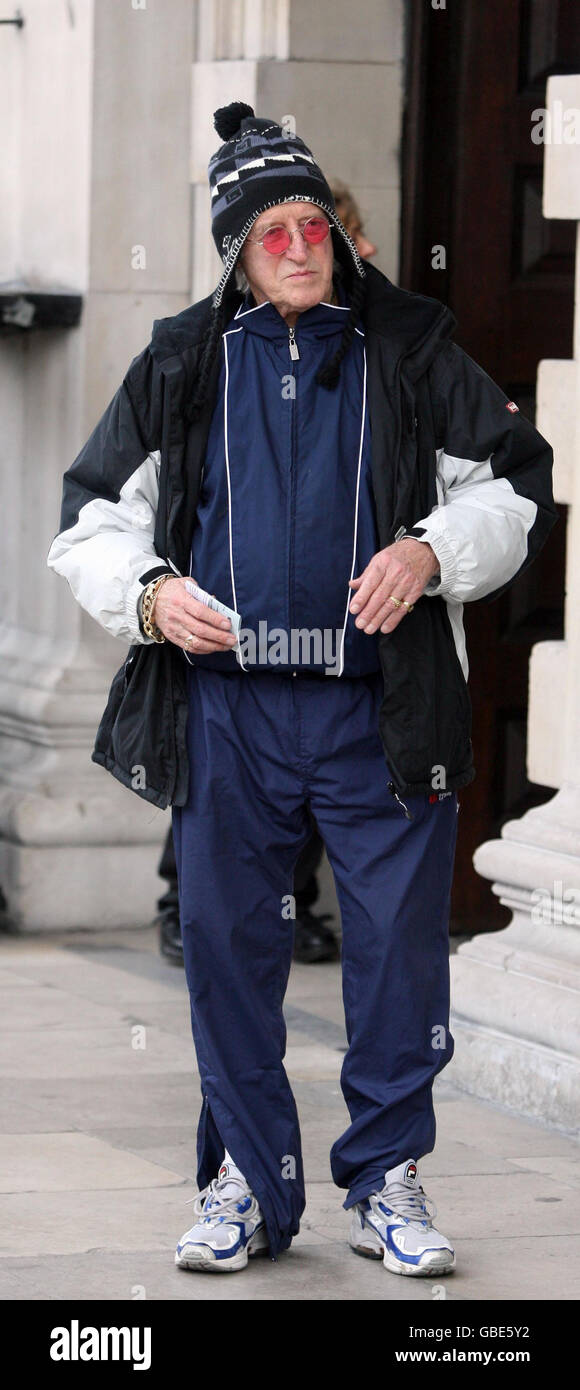 Sir Jimmy Savile attends a memorial service for Sir Bill Cotton, the BBC light entertainment executive, at St Martins-in-the-Fields, Trafalgar Square, London. Stock Photo