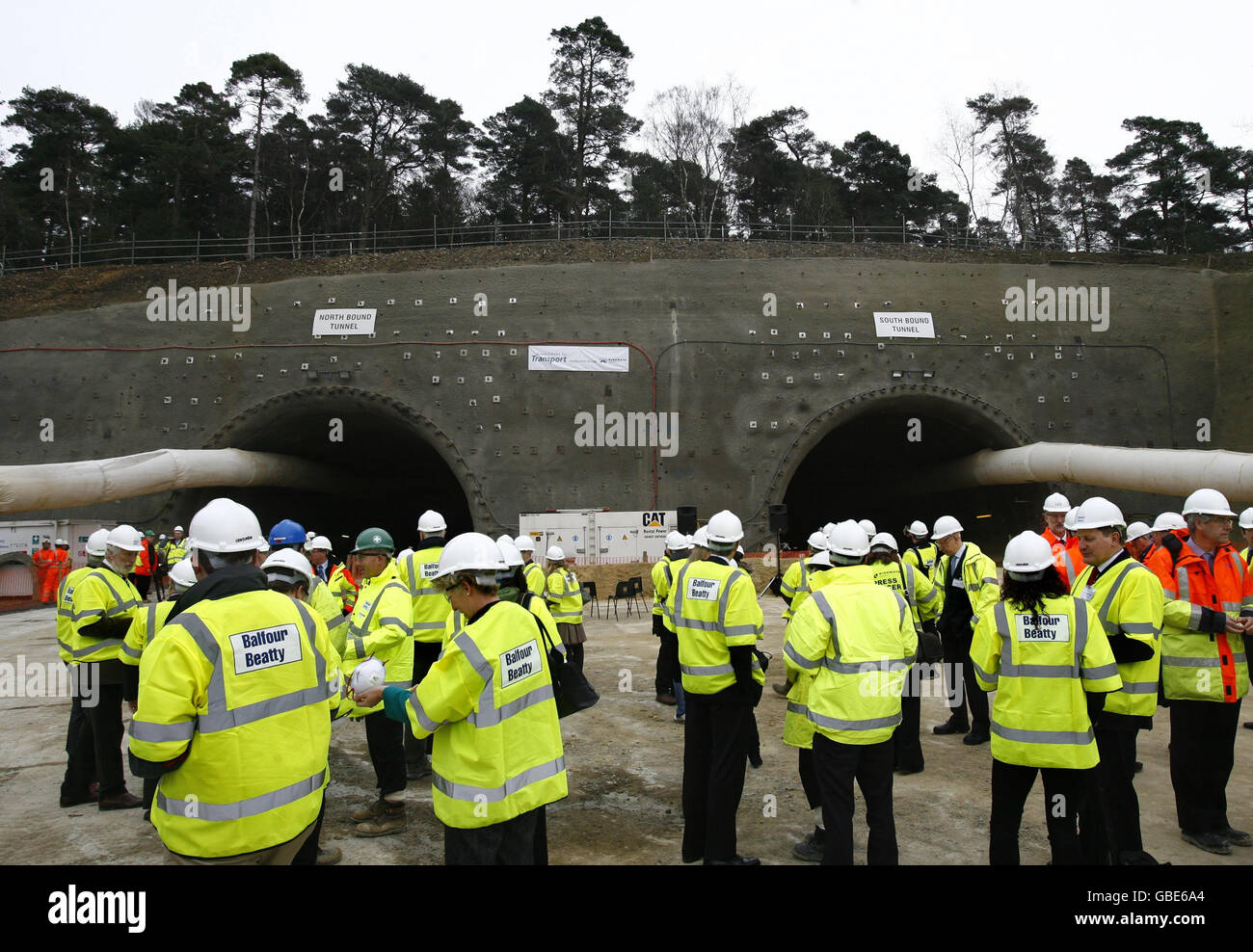 Invited guests arrive to witness the breakthrough to link the north and south tunnels, set to mark a major milestone for the UK's longest road tunnel under land, near Hindhead in Surrey. Stock Photo