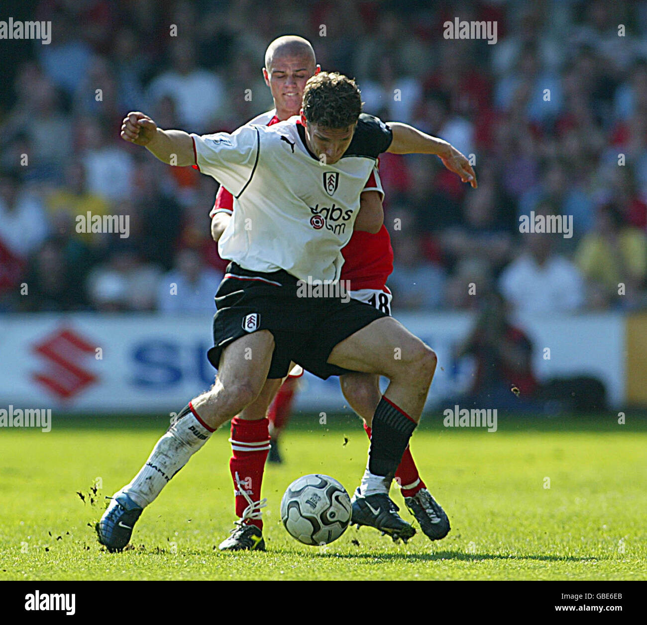 Soccer - FA Barclaycard Premiership - Fulham v Charlton Athletic. Fulham's Moritz Volz and Charlton Athletic's Paul Konchesky battle for the ball Stock Photo