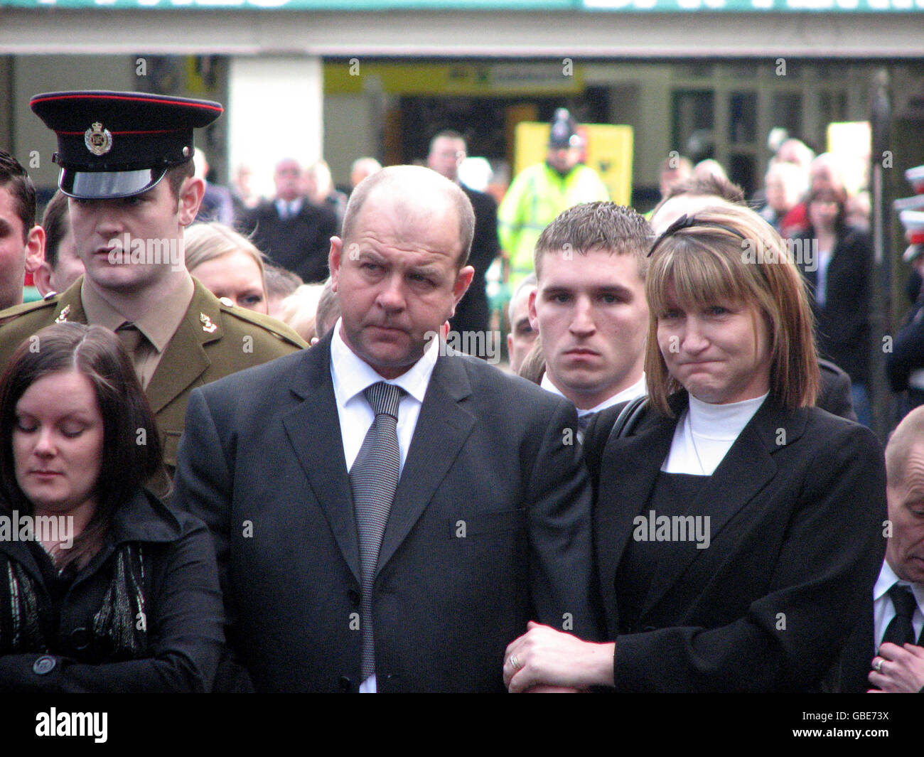 Friends and family of Corporal Danny Winter wait for his coffin to pass ...