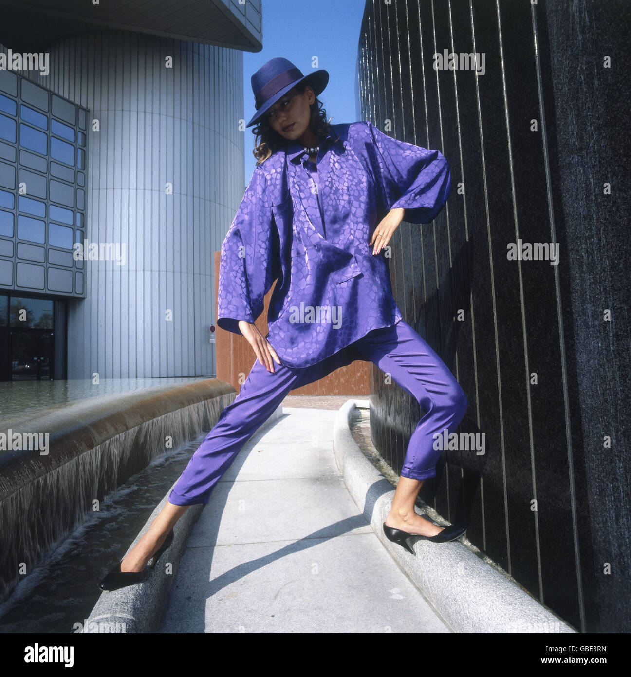 fashion, 1980s, young woman with lilac blouse, trousers and hat, location shot, Munich, Germany, Additional-Rights-Clearences-Not Available Stock Photo