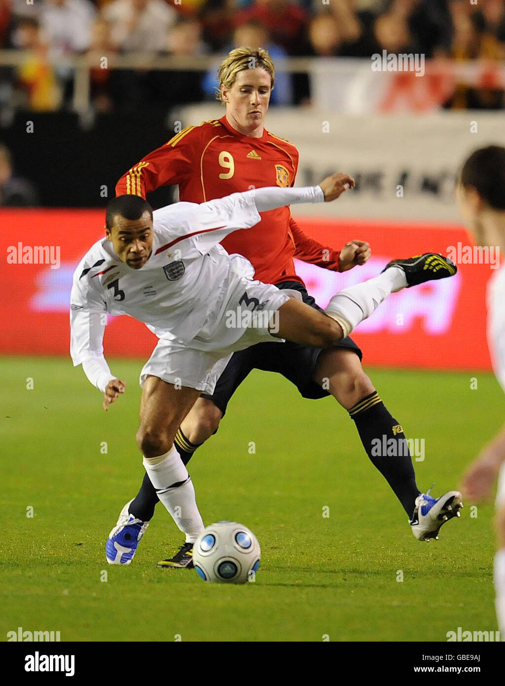 Spain's Fernando Torres (right) in action with England's Ashley Cole during the International Friendly at the Ramon Sanchez Pizjuan Stadium in Seville, Spain. Stock Photo