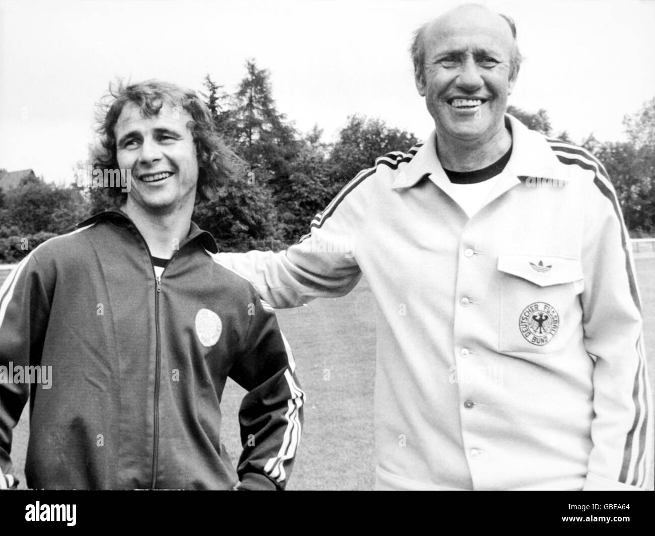 Soccer - World Cup West Germany 1974. West Germany coach Helmut Schon (r) with Bernd Holzenbein (l) at the team's training camp in Malente Stock Photo