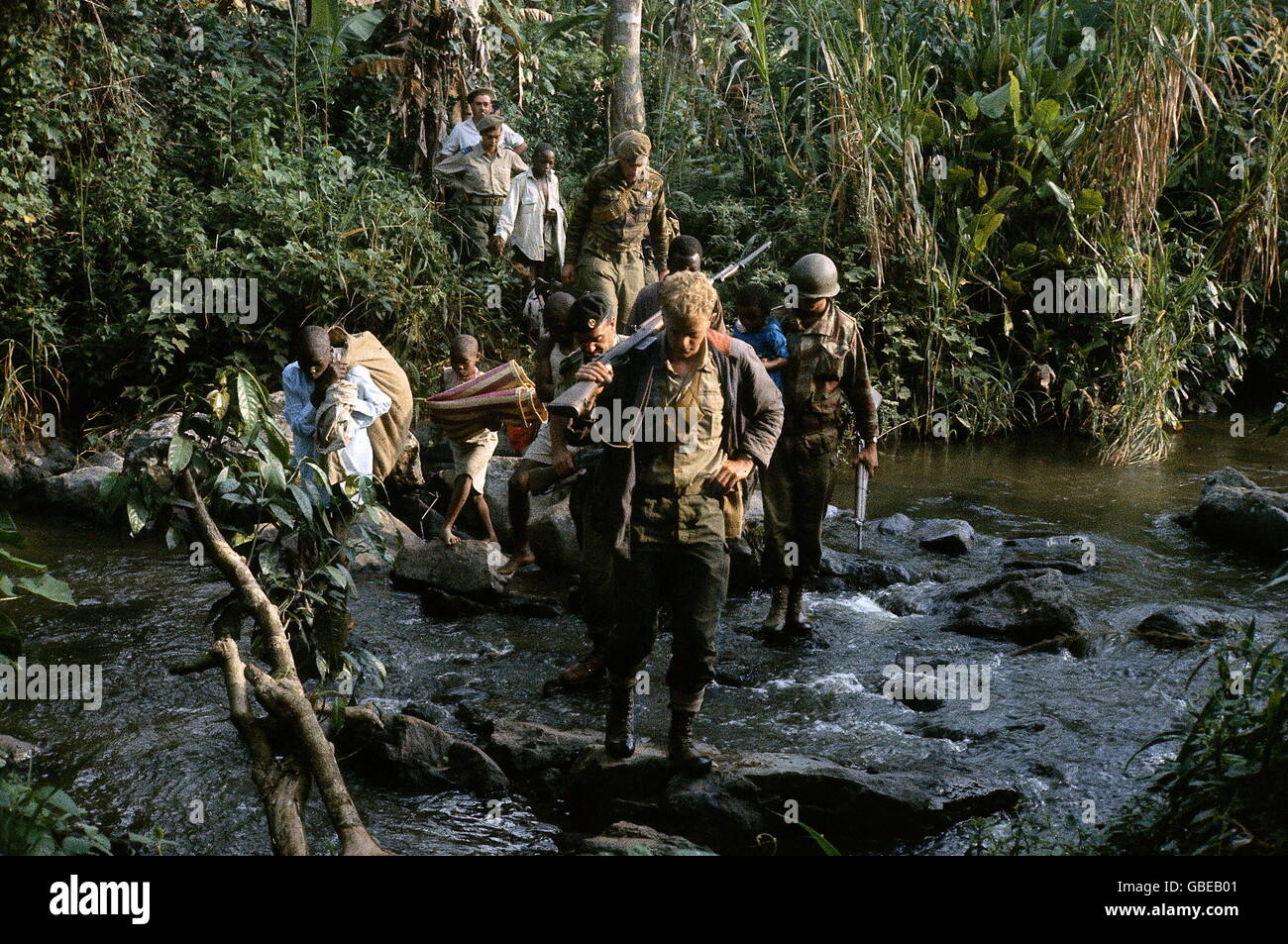 geography / travel, Congo, Simba uprising 1964 - 1965, mercenaries and native bearers marchin through the jungle, December 1964, Congo crisis, Civil War, Africa, military, march, creek, crossing,  20th century, historic, historical, people, male, man, men, 1960s, woman, women, female, Additional-Rights-Clearences-Not Available Stock Photo