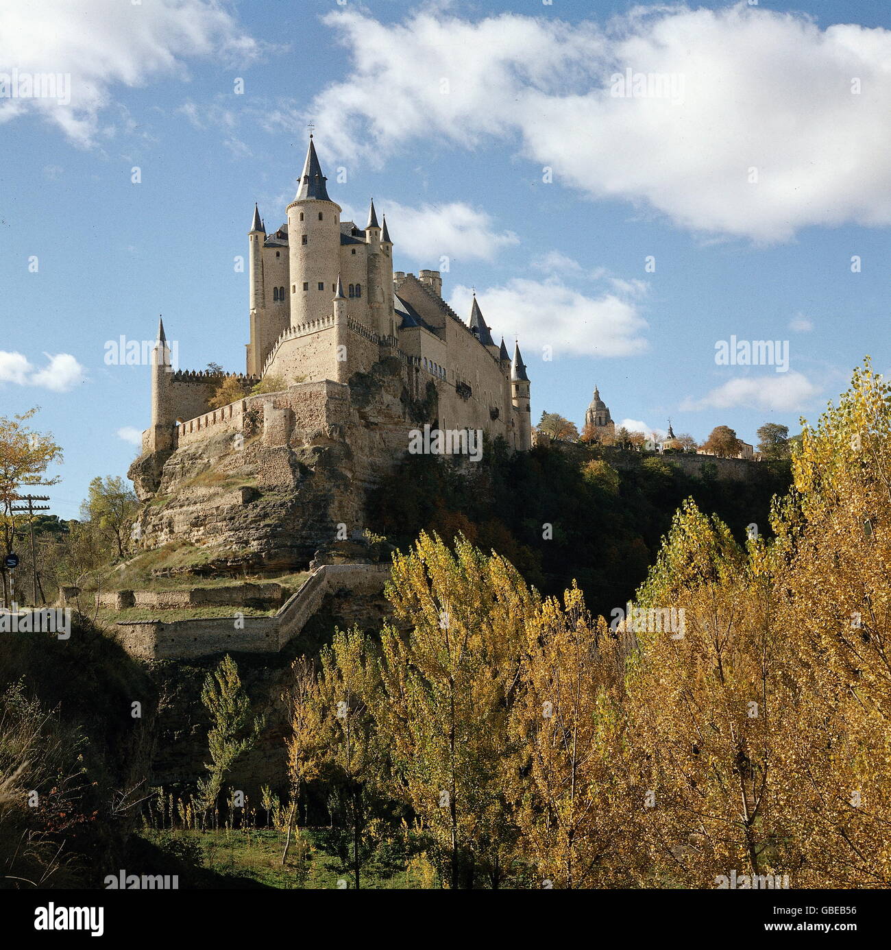 geography / travel,Spain,Segovia,Alcazar,built by the Moorish in the early 12th century,last modification in the late 16th century,view from West,in front: treasure tower,middle: tower of King Johann II,Old Castile,Castile,Reconquista,Middle Ages,royal palace,kingly residence,royal residence,treasury,treasure house,treasuries,military academy,Gothic style,Gothic period,fortress,fortresses,merlon,merlons,historic,historical,Sierra Guadarrama,world cultural heritage,world heritage list,South Western Europe,Southern Europe,Western ,Additional-Rights-Clearences-Not Available Stock Photo