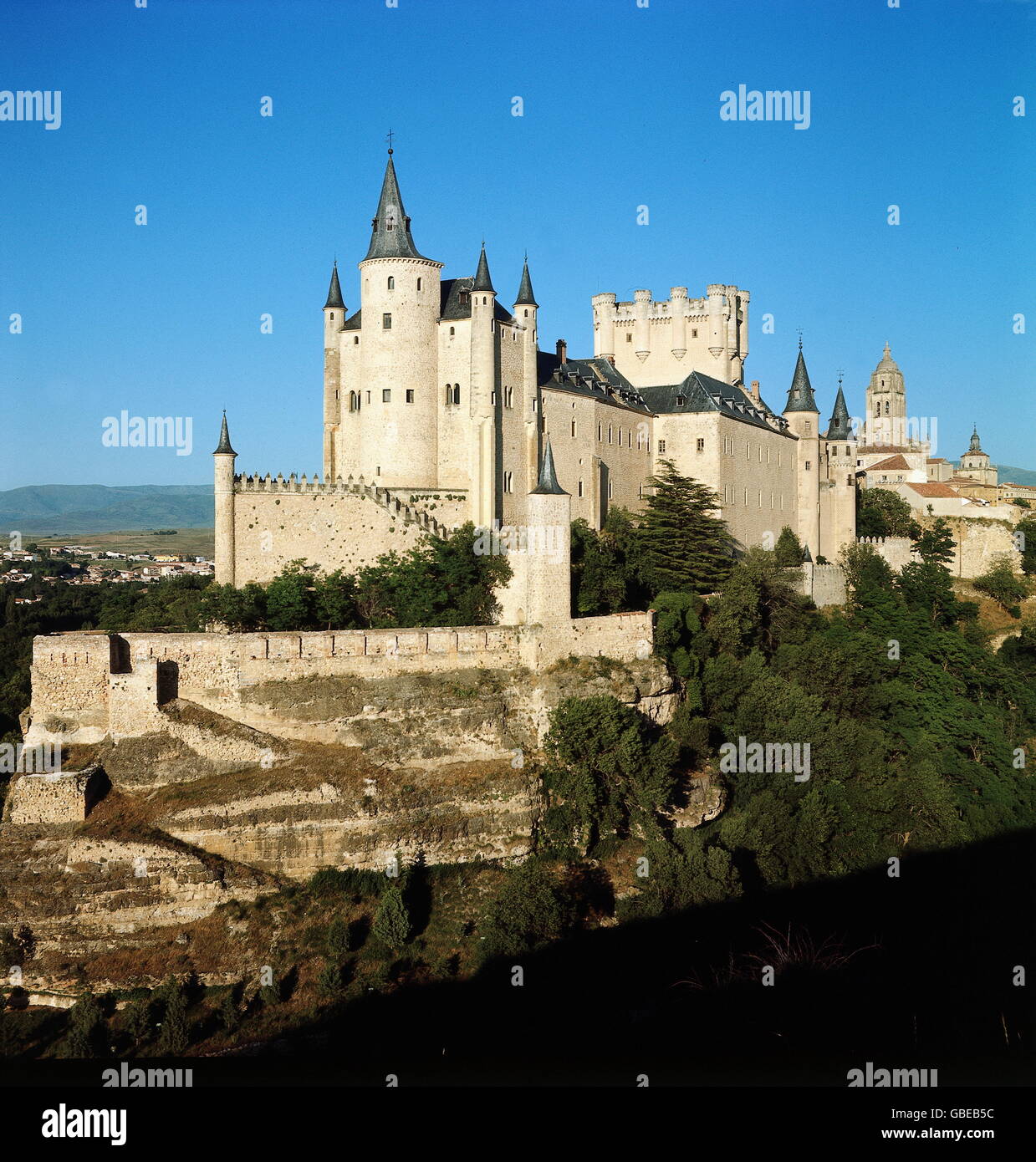 geography / travel,Spain,Segovia,Alcazar,built by the Moorish in the early 12th century,last modification in the late 16th century,view from Southwest,in front: treasure tower,middle: tower of King Johann II,Old Castile,Castile,Reconquista,Middle Ages,royal palace,kingly residence,royal residence,treasury,treasure house,treasuries,military academy,Gothic style,Gothic period,fortress,fortresses,merlon,merlons,historic,historical,Sierra Guadarrama,world cultural heritage,world heritage list,South Western Europe,Southern Europe,Wes,Additional-Rights-Clearences-Not Available Stock Photo