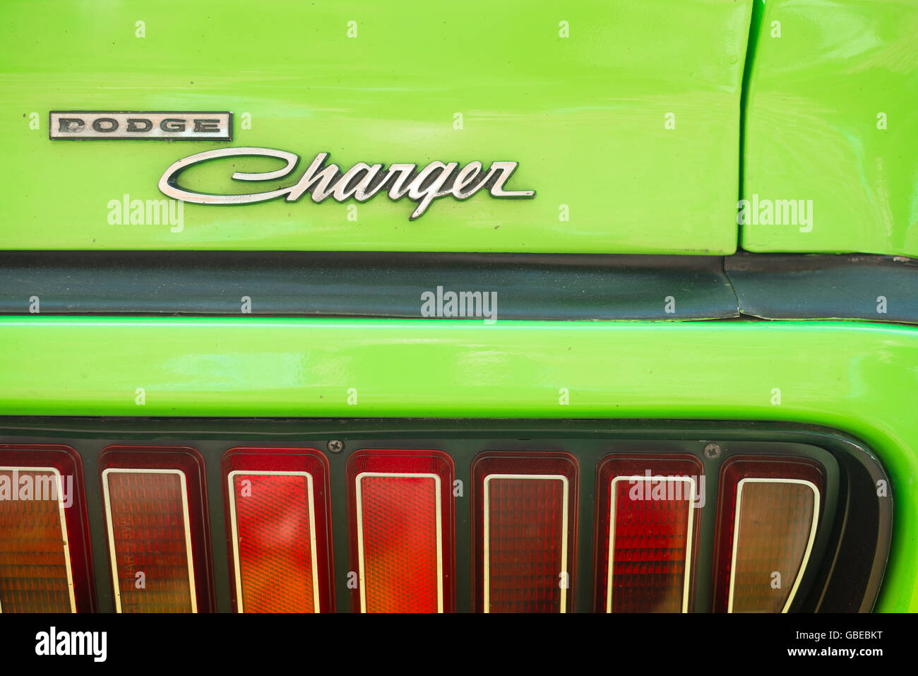 Detail of the rear light cluster of a lime green 1973 Dodge Charger car. Stock Photo