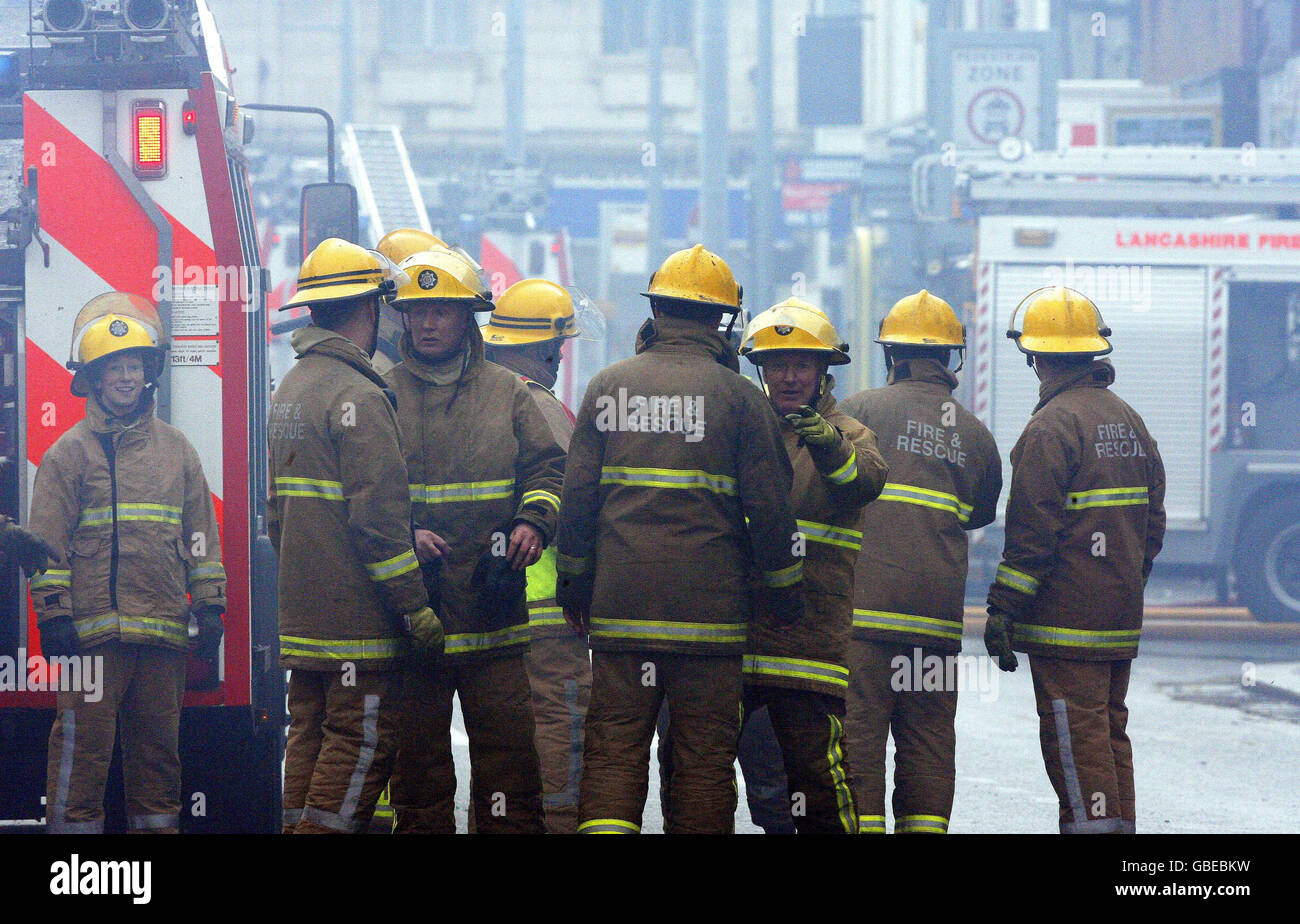 Firefighters tackle a blaze at a shopping centre in Blackpool. Stock Photo