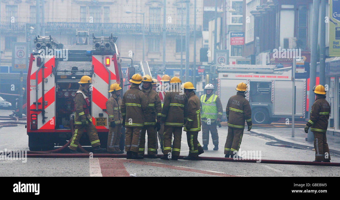 Firefighters tackle a blaze at a shopping centre in Blackpool. Stock Photo