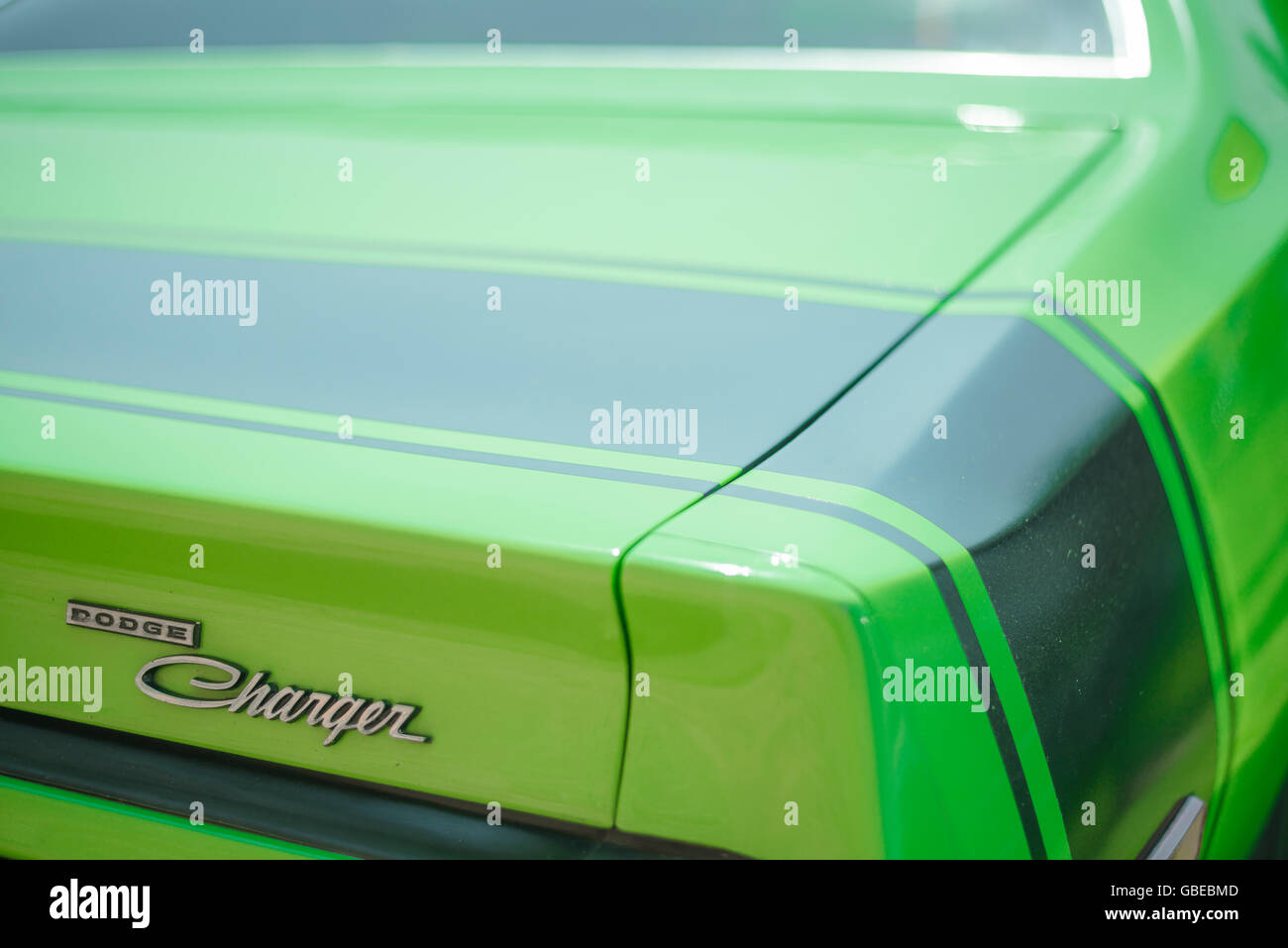 Rear wing of a 1973 lime green Dodge Charger car. Stock Photo