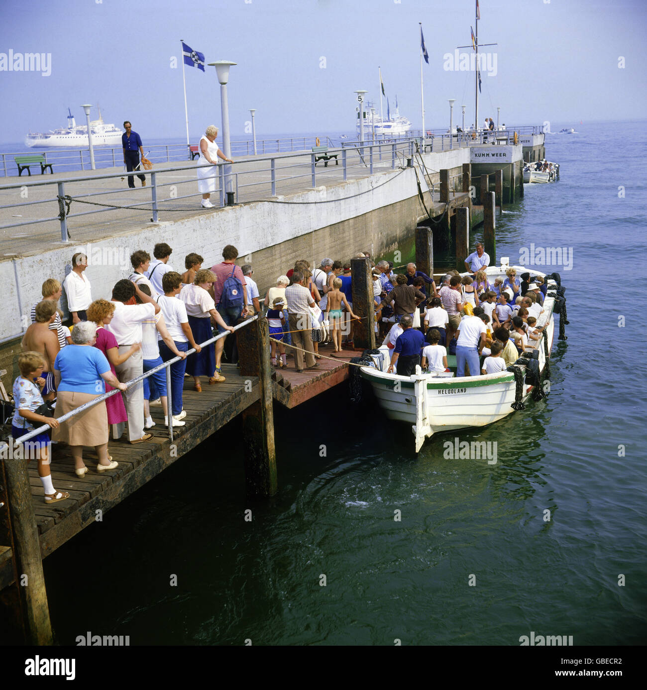 tourism, tourists during boarding of a tourist boat, pier, Heligoland, Germany, 1990s, 90s, 20th century, historic, historical, line of people, waiting line, landing stage, boat bridge, marina, marinas, North Sea, Central Europe, navigation, excursion, boat trip, Additional-Rights-Clearences-Not Available Stock Photo