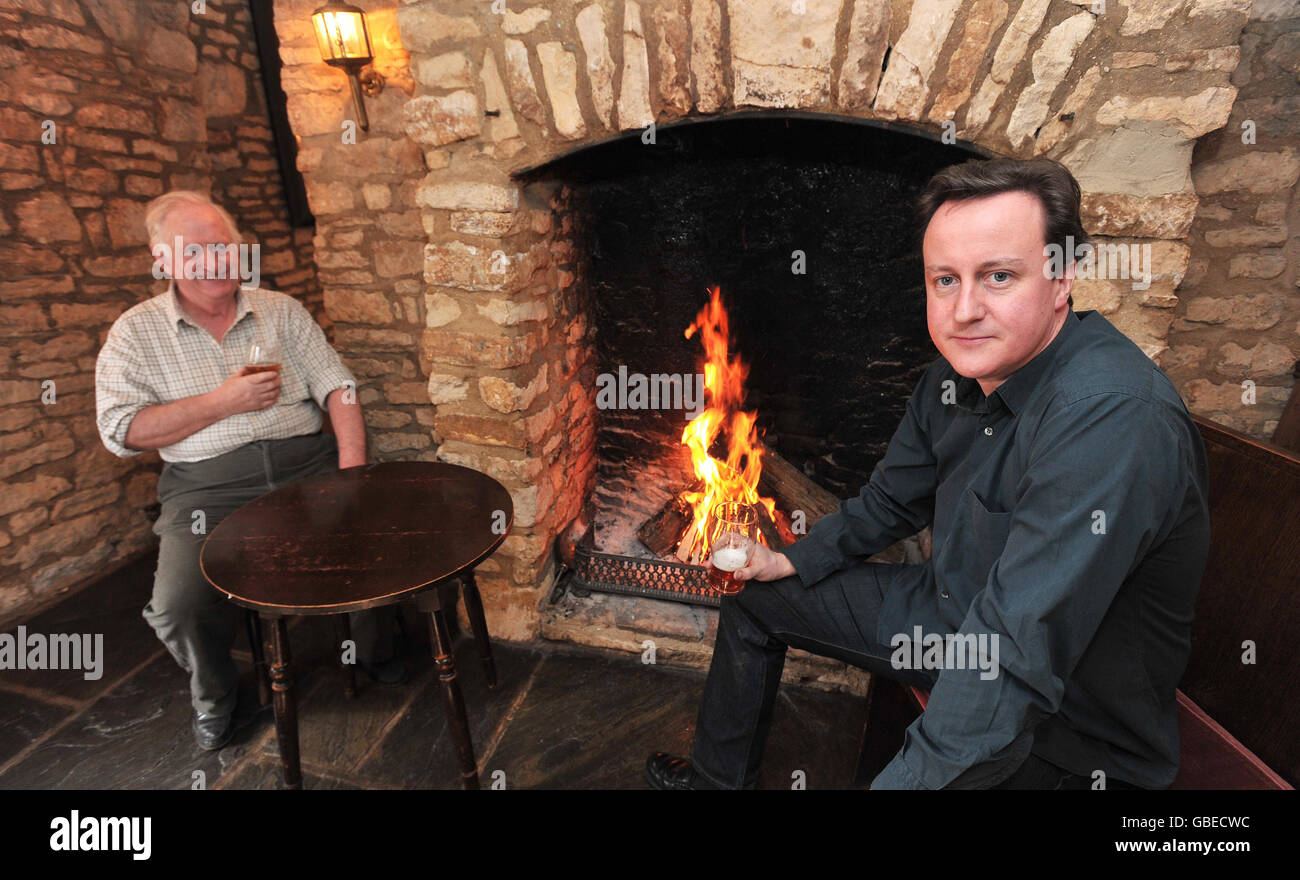 Leader of the Conservative Party David Cameron (right) talks to Robert John (left) in The Tite Inn, Chadlington, during a visit to his constituency. Stock Photo