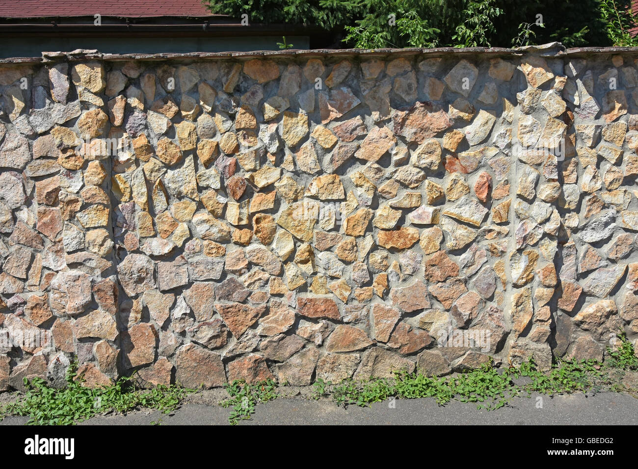 Stone wall and fence Stock Photo - Alamy