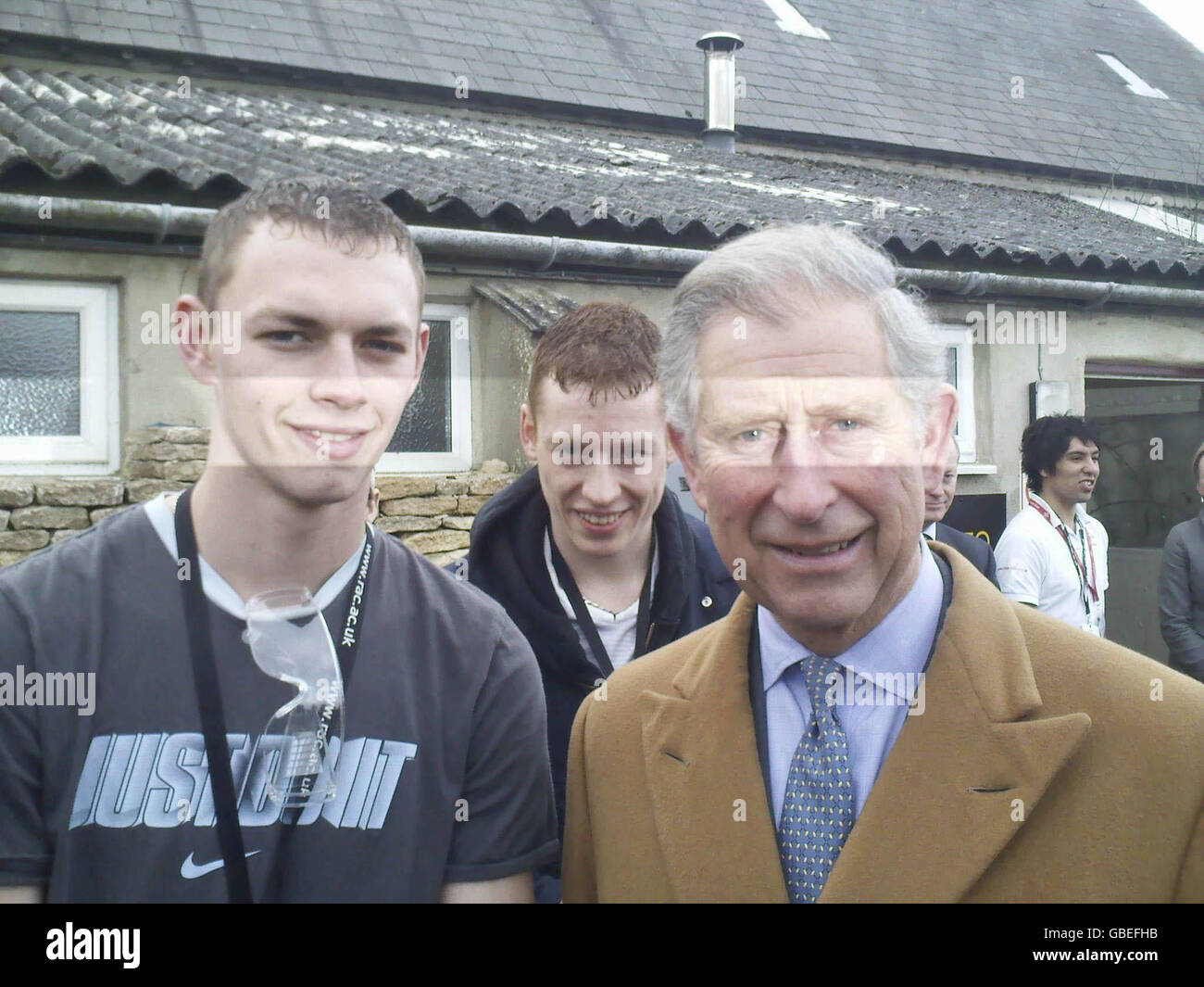 A mobile phone picture taken by Liam Brinkworth aged 21 from Cam, Gloucestershire of himself with the Prince of Wales of His Royal Highness the Prince of Wales with left, and Martin Withers aged 17 from Berkeley, Gloucestershire, centre, taken at an impromptu opportunity during his visit to The Rural Skills Centre, Cirencester, Gloucestershire. Liam, who's phone it was taken on will use the picture as his Facebook profile picture. Stock Photo