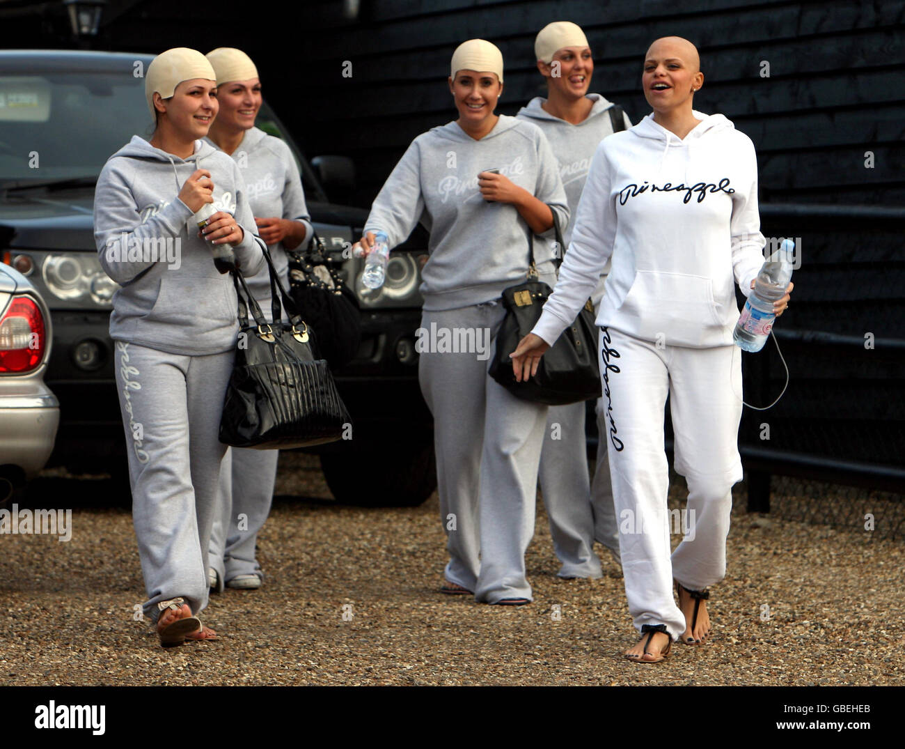 Reality television star Jade Goody with friends wearing joke skull caps outside her Essex home on the day before her wedding to fiance Jack Tweed. Stock Photo
