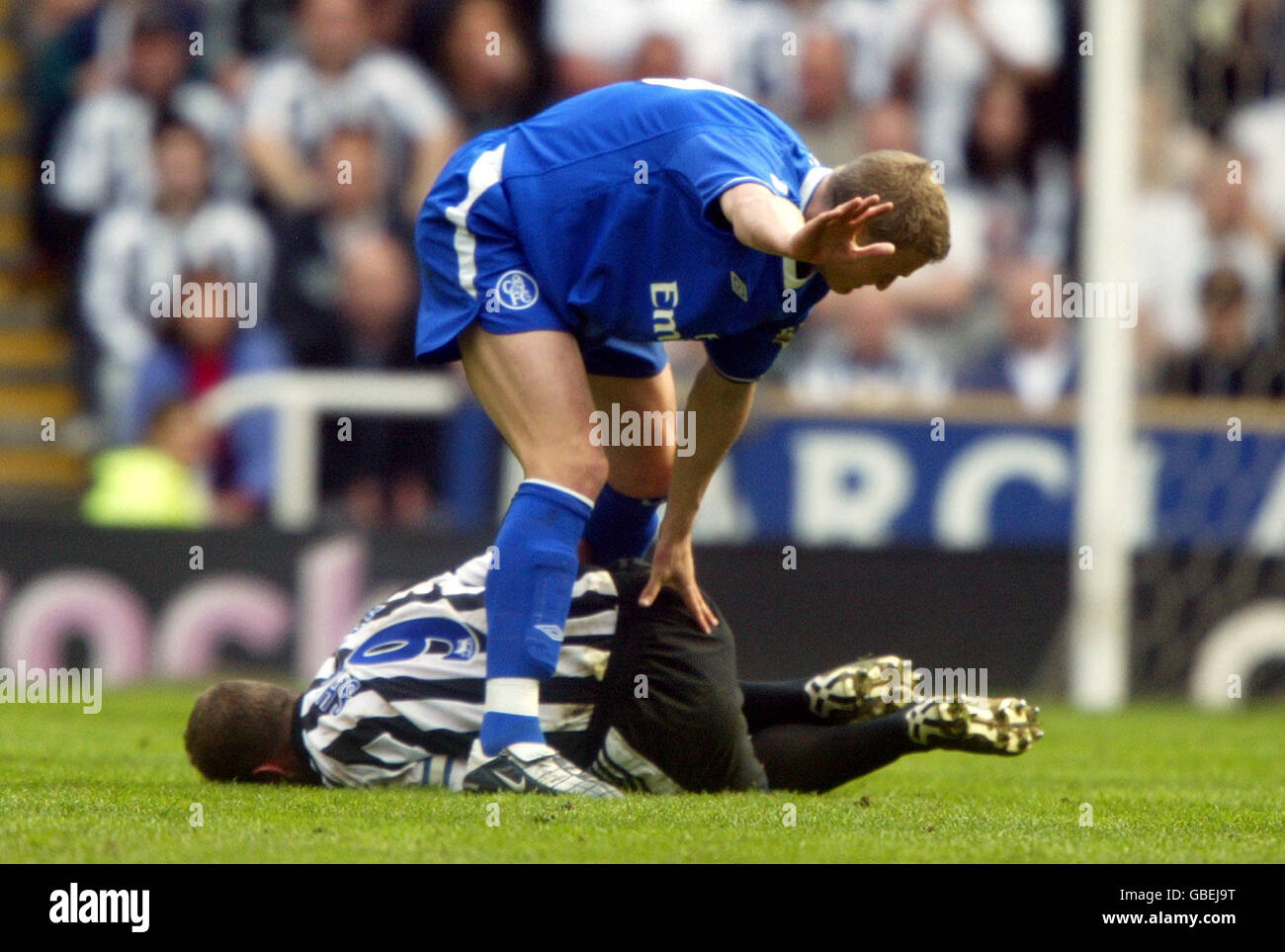 Newcastle United's Alan Shearer lies injured after an ...