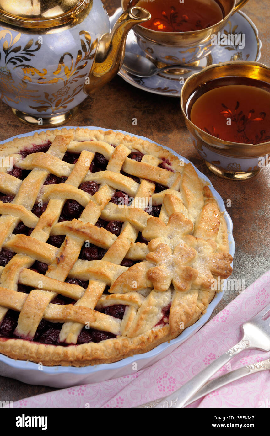 Cherry Pie Dough With Decorative Ornaments In Ceramic Roasting Pan