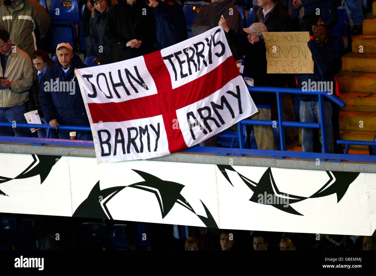Chelsea's fans display a banner in support of John Terry (also sign to right saying 'go home Peter Kenyon') Stock Photo