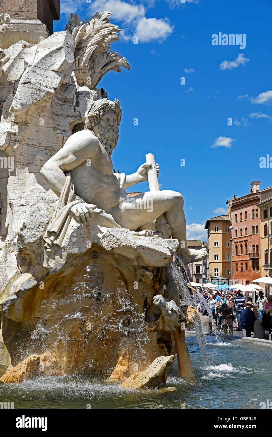 Four Rivers fountain, Fontana dei Quattro Fiumi, fountain, tourists, Piazza Navona, square, Rome, Lazio, Italy Stock Photo