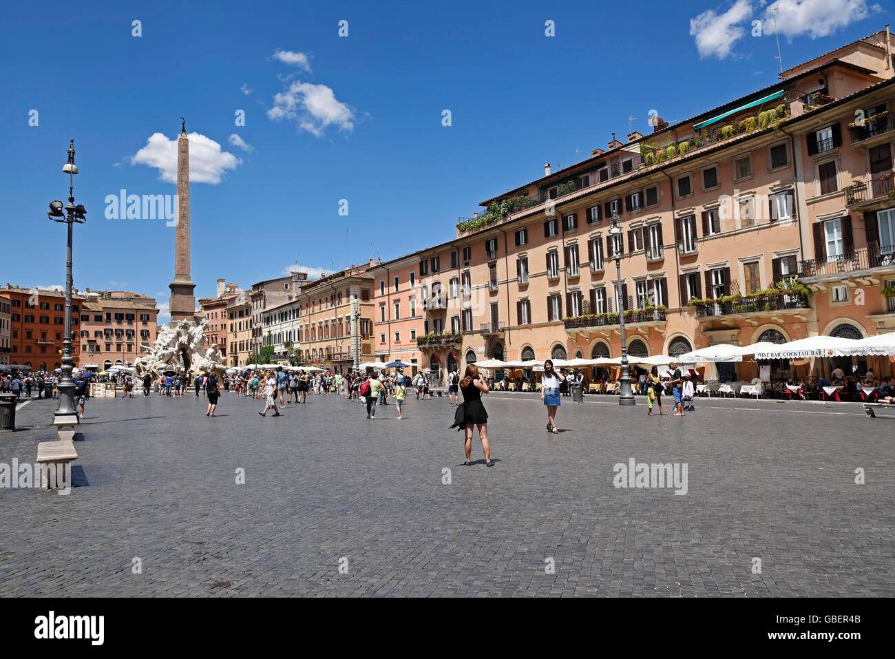 obelisk, Four Rivers fountain, Fontana dei Quattro Fiumi, fountain, tourists, Piazza Navona, square, Rome, Lazio, Italy Stock Photo