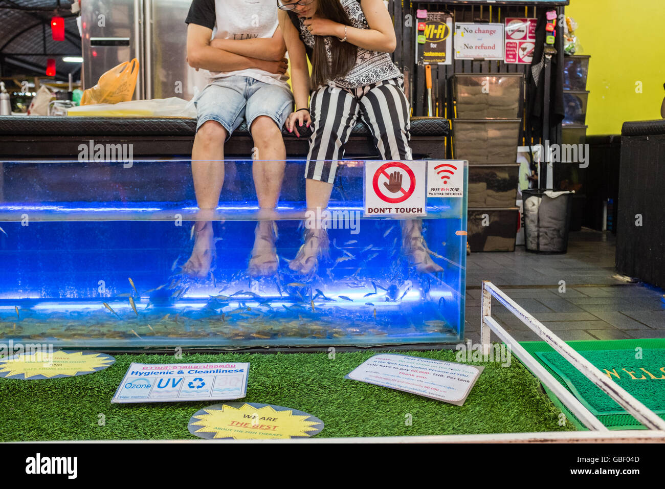 Couple Having Fish Foot Spa in Chiang Mai night market Stock Photo