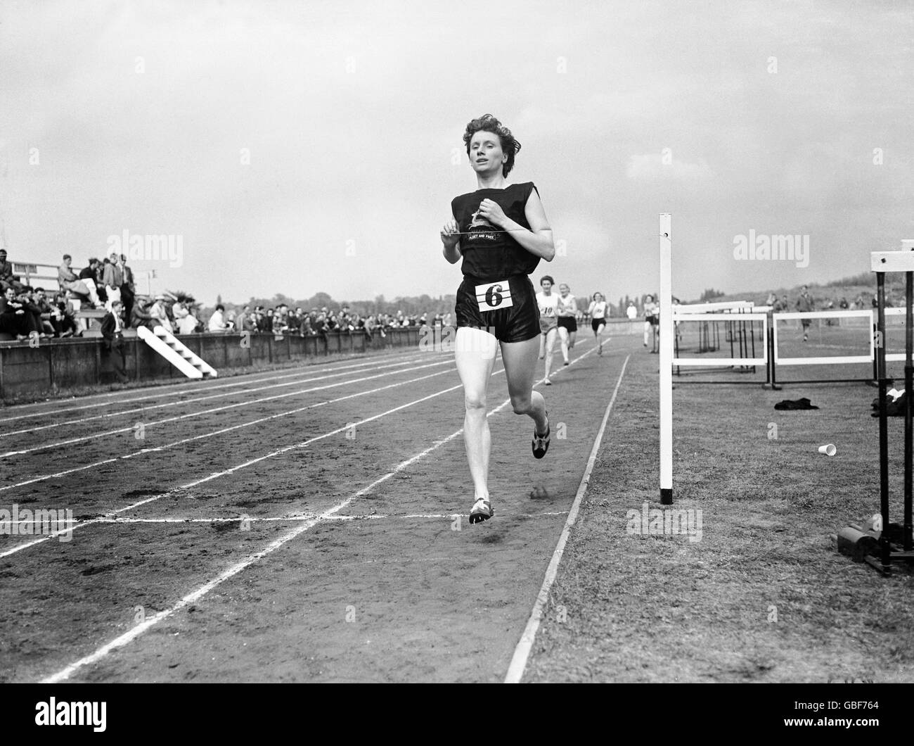 Diane Leather crosses the line to win the women's 880yds in 2min 15.8secs. Stock Photo