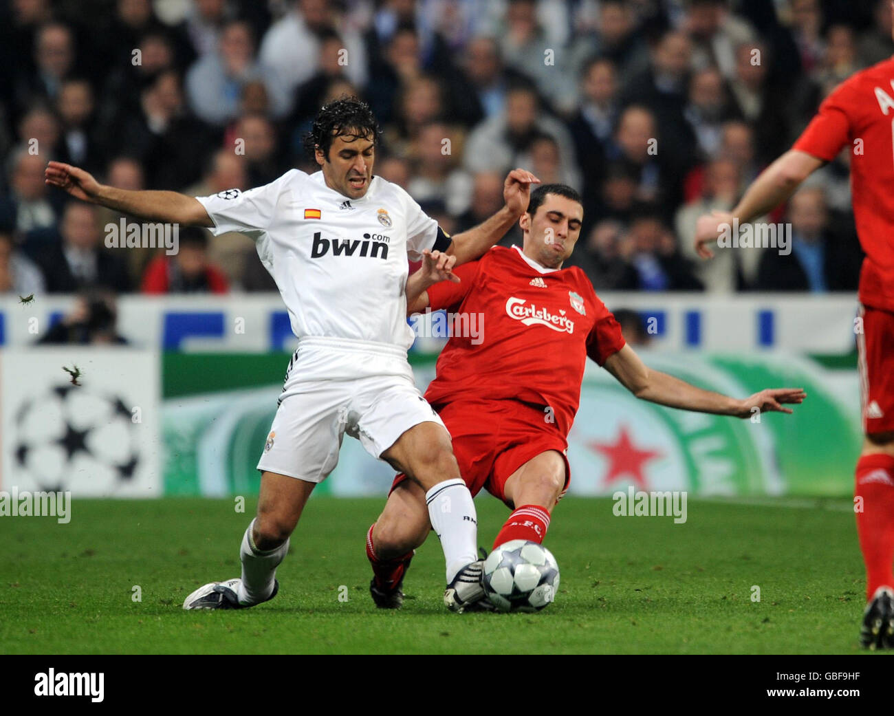 Liverpool's Alvaro Arbeloa (right) and Real Madrid Gonzalez Raul (left) battle for the ball during the UEFA Champions League match at the Santiago Bernabeu, Madrid, Spain. Stock Photo