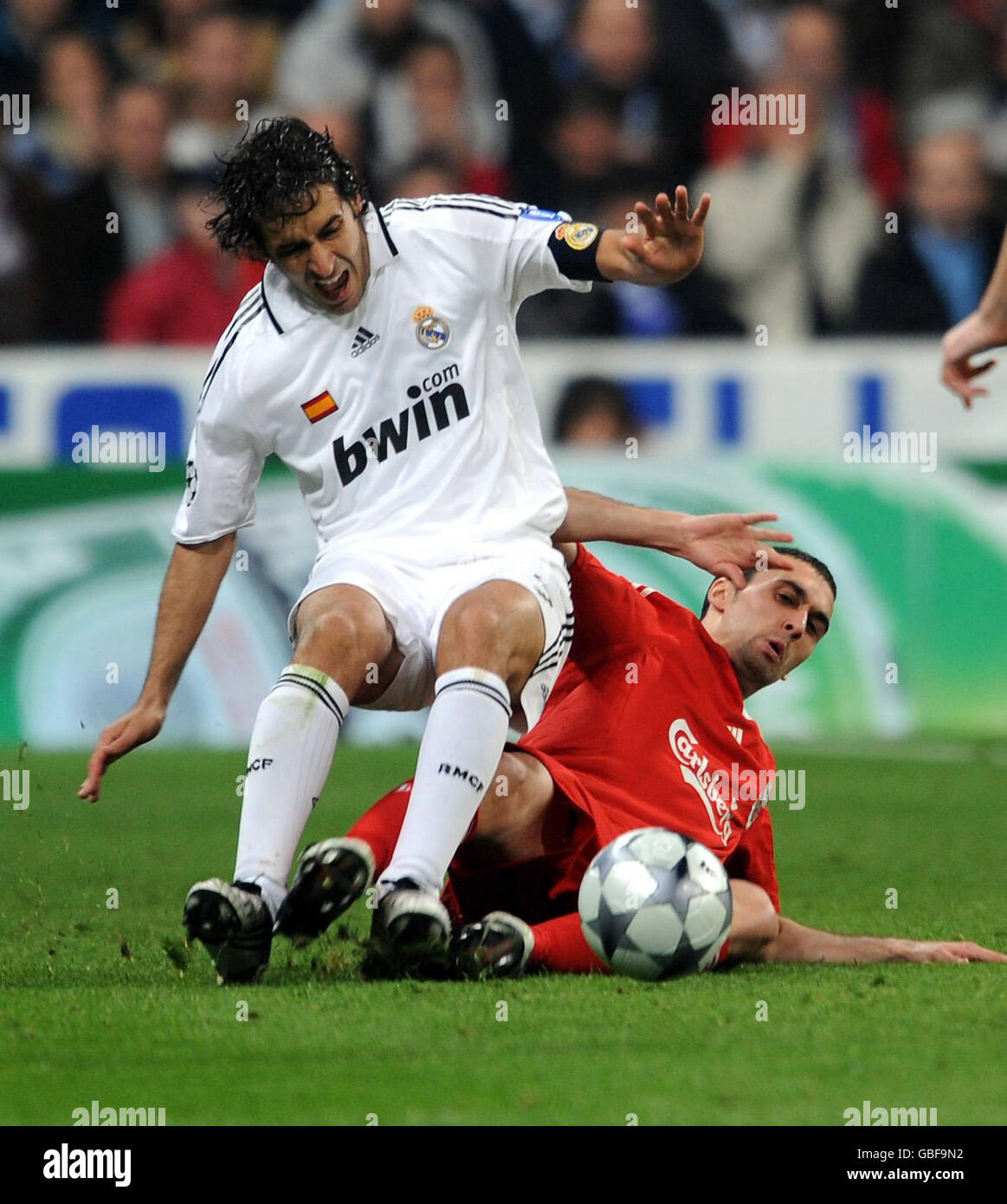 Liverpool's Alvaro Arbeloa (right) and Real Madrid Gonzalez Raul (left) battle for the ball during the UEFA Champions League match at the Santiago Bernabeu, Madrid, Spain. Stock Photo