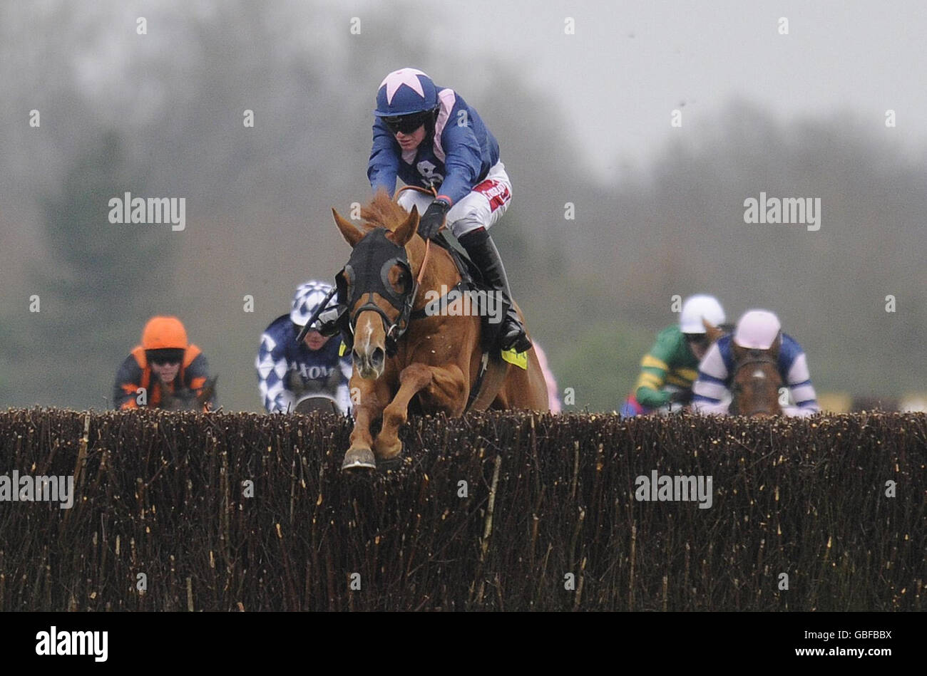 New Little Bric ridden by Nick Scholfield takes the last before winning The totesport.com Gold Cup Handicap Chase during totesport.com Gold Cup Day at Newbury Racecourse, Newbury. Stock Photo