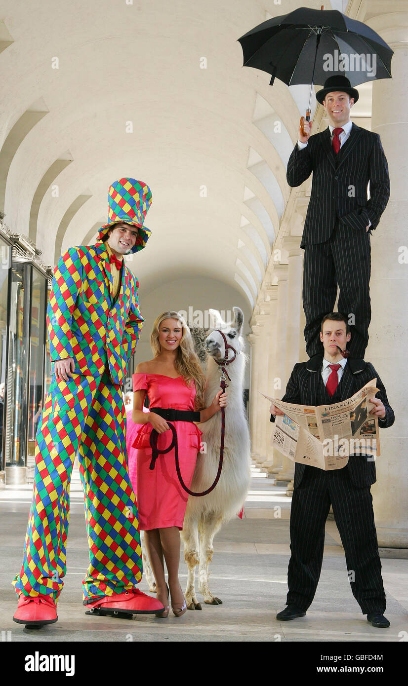 'Dancing on Ice' contestant and TV star Zoe Salmon is surrounded by stars of La Clique, a harlequin on stilts and Spinach the llama for the opening of Lastminute.com's first 'good stuff' store, in London's Covent Garden. Stock Photo