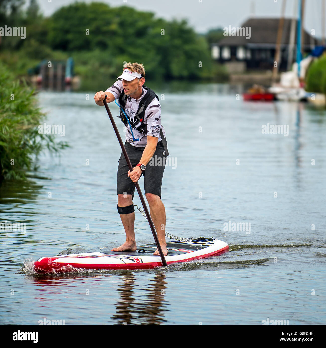 Paddle boarder on the Norfolk broads Stock Photo