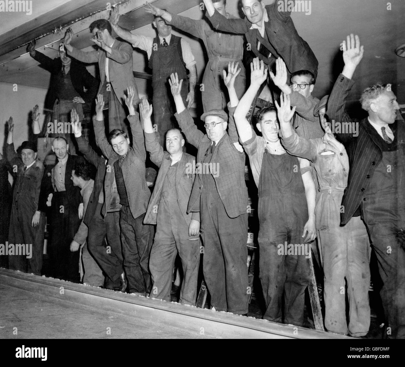 Workers installing the largest plateglass window in Europe at the Pan