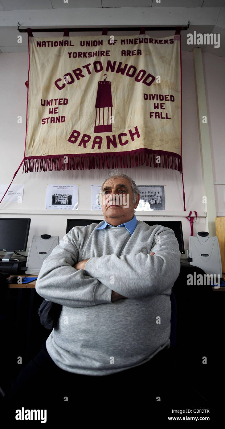 Sid Bailey, who worked at Cortonwood Colliery for 28 years, with the NUM Branch Banner they carried through the miners' strike. The threatened closure of Cortonwood sparked the year long miner's strike which marks its 25th anniversary this month. Stock Photo