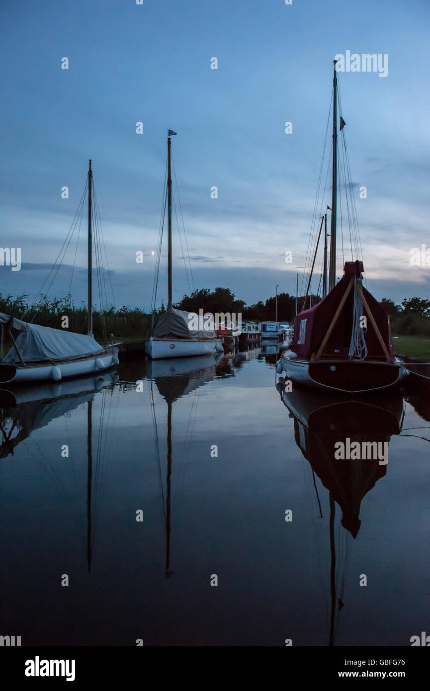 Norfolk broads mored boats in the evening Stock Photo